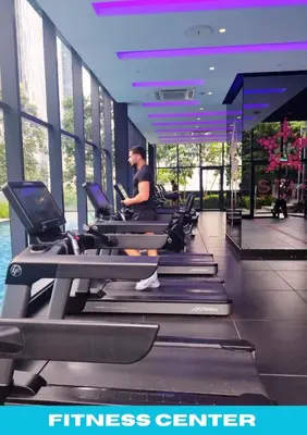 a man exercising on a treadmill in a gym at Star Executive View KLCC in Kuala Lumpur