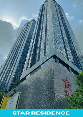 a tall building with a sign in front of it at Star Executive View KLCC in Kuala Lumpur