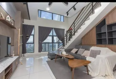a living room with a couch and a table at BMC Arte Mont Kiara in Kuala Lumpur