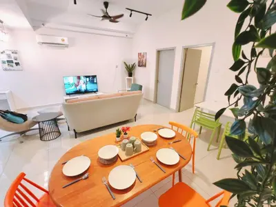 a living room with a table and a couch at Vivo Soho - 2 Bedrooms, Mid Valley, Bangsar South, Campus Rangers in Kuala Lumpur