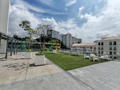 a park with white benches in a city at Vivo Soho - 2 Bedrooms, Mid Valley, Bangsar South, Campus Rangers in Kuala Lumpur