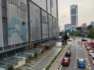 a city street with cars parked in front of a building at Robertson S15 KLCC Alor Street Bukit Bintang 5Pax in Kuala Lumpur