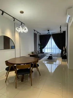 a living room with a dining room table and a couch at KL Nice Condo in Kuala Lumpur