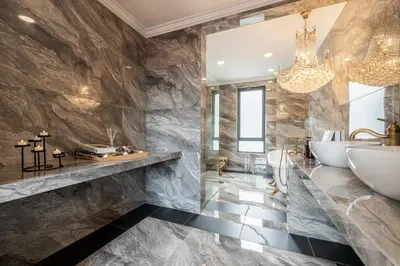 a bathroom with marble walls and a chandelier at The Noble Bungalow, 18pax 5R4B near Datuk Keramat, KL Pavilion in Kuala Lumpur