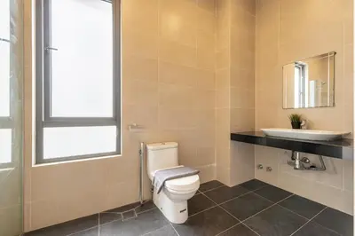 a bathroom with a toilet and a sink at The Noble Bungalow, 18pax 5R4B near Datuk Keramat, KL Pavilion in Kuala Lumpur