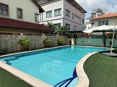 a swimming pool in the middle of a building at Grand Luxe Bangalow 8BR, Ampang Utama Park, LRT in Ampang