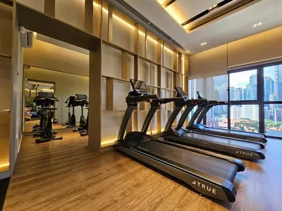 a gym with several treadmills and a row of tread machines at Bukit Bintang Agile 400m to TRX DualKey 2-7pax in Kuala Lumpur