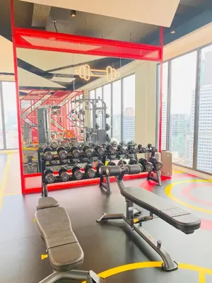 a gym with a lot of equipment in a building at Majestic Residence KLCC by Nexus Suites in Kuala Lumpur