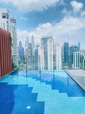 a swimming pool on the roof of a building at Majestic Residence KLCC by Nexus Suites in Kuala Lumpur