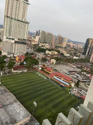 a soccer field in the middle of a city at INFINITUM Stay at klcc in Kuala Lumpur