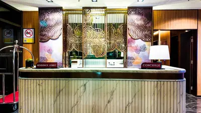 a bar in a hotel with a colorful wall at Imperial Residence KLCC - MJ Home in Kuala Lumpur