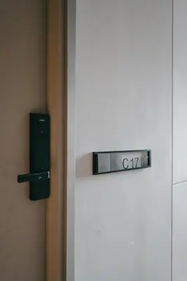 a door with a sign that says cork on it at Cozy Minimalist Studio KL, Agile Residence Bukit Bintang in Kuala Lumpur