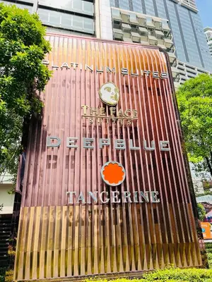a building with a clock on the side of it at Peace Pavilion At Platinum in Kuala Lumpur