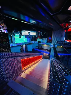 a bowling alley with a red seat in a club at Peace Pavilion At Platinum in Kuala Lumpur