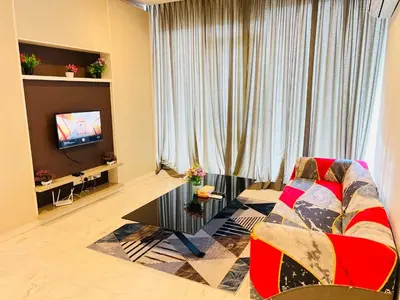 a living room with a couch and a tv at Peace Pavilion At Platinum in Kuala Lumpur