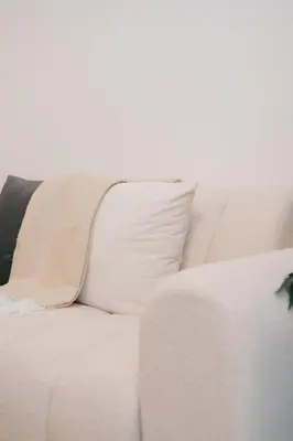 a white couch with a black and white pillow at Modern Cozy Home Kuala Lumpur, Agile Residence Bukit Bintang in Kuala Lumpur