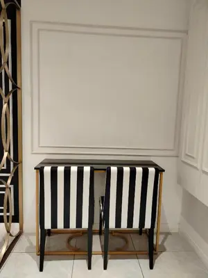 a black and white console table with two black and white chairs at Unitopia near KLCC pavillion in Kuala Lumpur