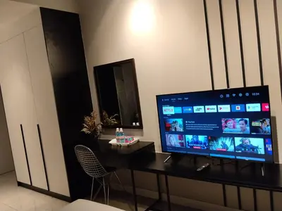 a computer desk with a monitor on top of it at Unitopia near KLCC pavillion in Kuala Lumpur