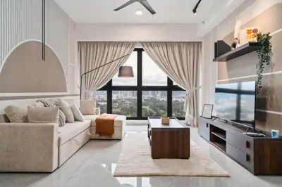 a living room with a white couch and a large window at Grand 2BR Agile Bukit Bintang BY RumaBnB in Kuala Lumpur