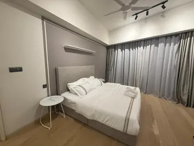 a bedroom with a white bed and a window at KL Star Residance in Kuala Lumpur