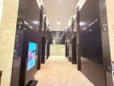 a hallway in a building with signs on the walls at Platinum Klcc by StayAura in Kuala Lumpur