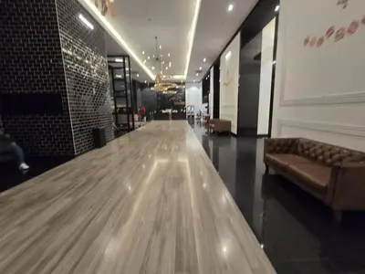 a long hallway with a couch in a building at Chambers residence klcc by Gajilion in Kuala Lumpur