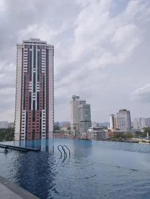 a large pool of water in front of a city at Chambers residence klcc by Gajilion in Kuala Lumpur
