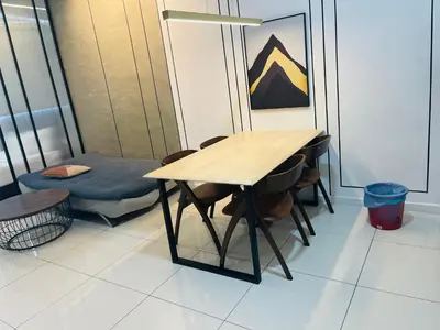 a table and a chair in a room at Chambers residence klcc by Gajilion in Kuala Lumpur