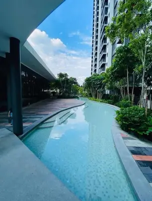 a swimming pool in front of a building at M Arisa Sentul KL City view in Kuala Lumpur