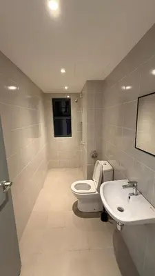 a bathroom with a toilet and a sink at M Arisa Sentul KL City view in Kuala Lumpur