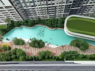 a swimming pool in a building with a large building at M Arisa Sentul KL City view in Kuala Lumpur