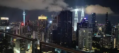 a view of a city skyline at night at Homestay at Wyndham Suites KLcc in Kuala Lumpur