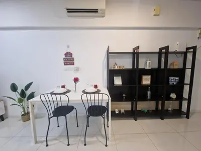 a white table with two chairs and a shelf at Summer suites klcc 5 min walk by AA Global in Kuala Lumpur