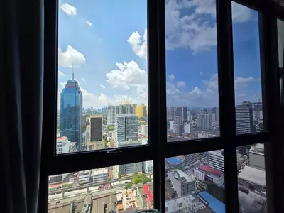 a view of a city skyline from a window at Majestic KLCC By Flora in Kuala Lumpur