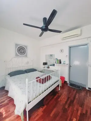 a bedroom with a white bed with a ceiling fan at Shahana Homestay KL for musleem in Kuala Lumpur