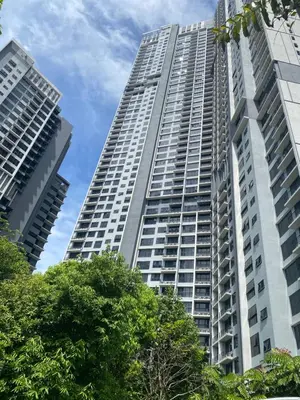 a tall building with trees in front of it at Agile Bukit Bintang KL in Kuala Lumpur