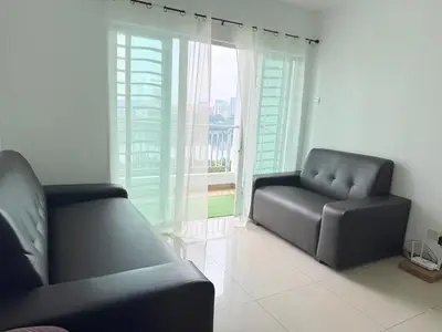 a living room with a couch and a window at Happy Homes Kuala Lumpur Rooms in Kuala Lumpur