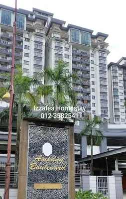a sign in front of a large building at Izzafea in Ampang
