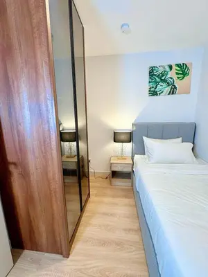 a bedroom with a bed and a large mirror at Premium Executive Family Suites 3Bedroom at The Atrium Ampang by OKBnB in Kuala Lumpur