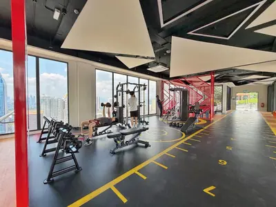 a gym with treadmills and machines in a building at Majestic Unique Studio Suite with Infinity Pool in Kuala Lumpur