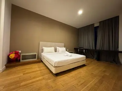 a bedroom with a white bed in a room at White stone suites in Kuala Lumpur