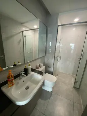 a bathroom with a sink and a shower and a toilet at Agile Bukit Bintang Save Home in Kuala Lumpur