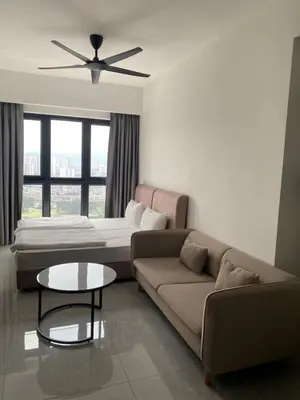 a living room with a couch and a bed at Agile Bukit Bintang Save Home in Kuala Lumpur