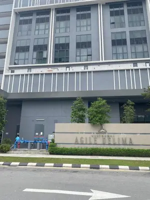 a building with a sign in front of it at Agile Bukit Bintang Save Home in Kuala Lumpur