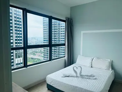 a bedroom with a bed with a swan towel on it at Arte Plus by Jerry in Kuala Lumpur