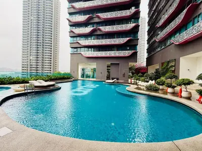 a large swimming pool in front of a building at Arte Plus by Jerry in Kuala Lumpur