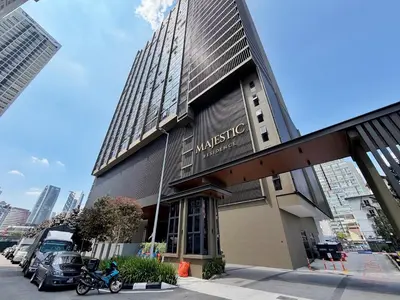a building with a sign on the side of it at Majestic Wonder Studio Suite with Infinity Pool in Kuala Lumpur