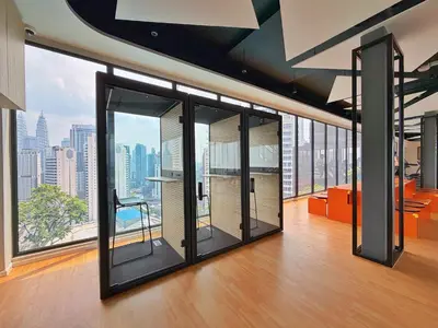 an office with large windows with a view of the city at Majestic Wonder Studio Suite with Infinity Pool in Kuala Lumpur