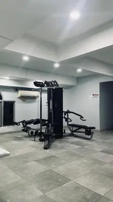 a gym with several tread machines in a room at Homestay in Kuala Lumpur