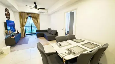 a dining room and living room with a table and chairs at Jalan Ampang KLCC Embassy Area Homestay in Kuala Lumpur